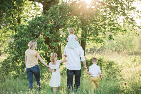 family walking in a field