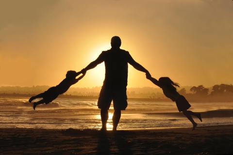 man playing with his two children